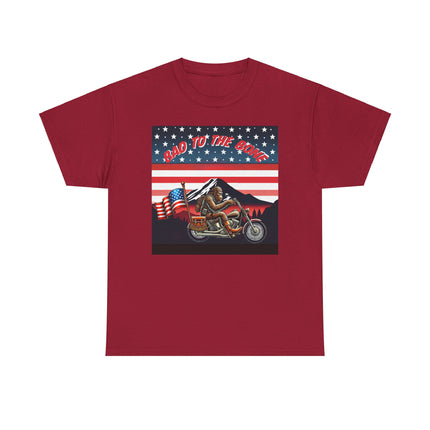 This tee has bigfoot riding on a motorcycle with an American flag hanging off the back. he's riding in front of a mountain that's in front of a patriotic background of stars and stripes. This tee is red