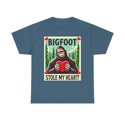 This tee features a bigfoot graphic with Bigfoot holding a heart and smiling. It says "Bigfoot Stole My Heart!" It's perfect for Bigfoot lovers of all ages. This tee is blue-gray