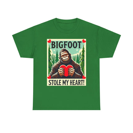 This tee features a bigfoot graphic with Bigfoot holding a heart and smiling. It says "Bigfoot Stole My Heart!" It's perfect for Bigfoot lovers of all ages. This tee is green