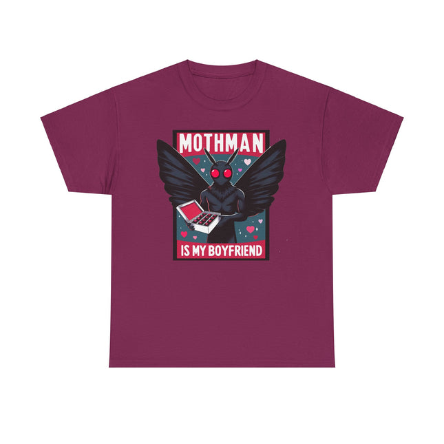 This tee depicts a square picture of Mothman standing between the words "Mothman is my boyfriend" and Mothman is holding a box of chocolates. This tee is maroon