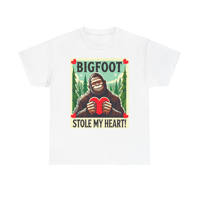 This tee features a bigfoot graphic with Bigfoot holding a heart and smiling. It says "Bigfoot Stole My Heart!" It's perfect for Bigfoot lovers of all ages. This tee is white