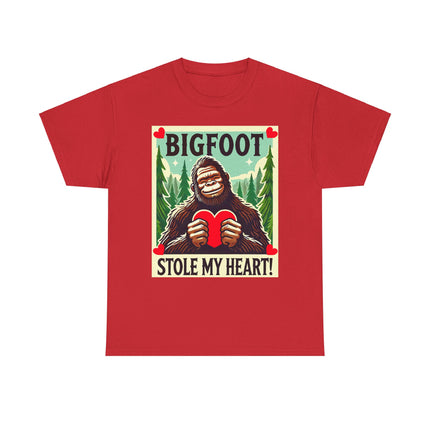 This tee features a bigfoot graphic with Bigfoot holding a heart and smiling. It says "Bigfoot Stole My Heart!" It's perfect for Bigfoot lovers of all ages. This tee is red