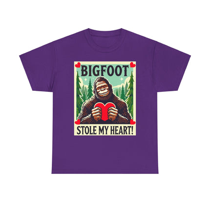 This tee features a bigfoot graphic with Bigfoot holding a heart and smiling. It says "Bigfoot Stole My Heart!" It's perfect for Bigfoot lovers of all ages. This tee is purple