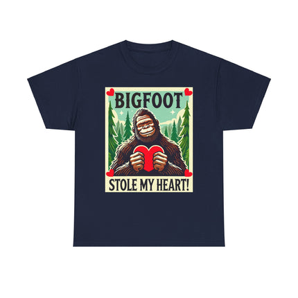 This tee features a bigfoot graphic with Bigfoot holding a heart and smiling. It says "Bigfoot Stole My Heart!" It's perfect for Bigfoot lovers of all ages. This tee is nvy