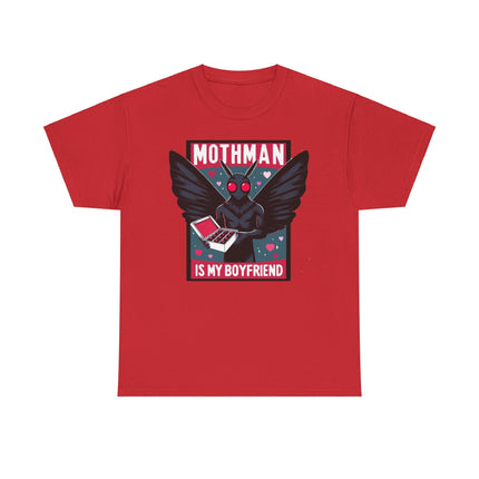 This tee depicts a square picture of Mothman standing between the words "Mothman is my boyfriend" and Mothman is holding a box of chocolates. This tee is red