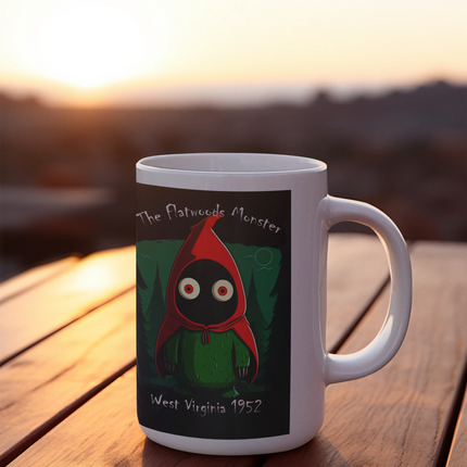 Ceramic mug featuring a whimsical graphic of the Flatwoods Monster, perfect for enjoying your favorite beverages while celebrating cryptid lore.