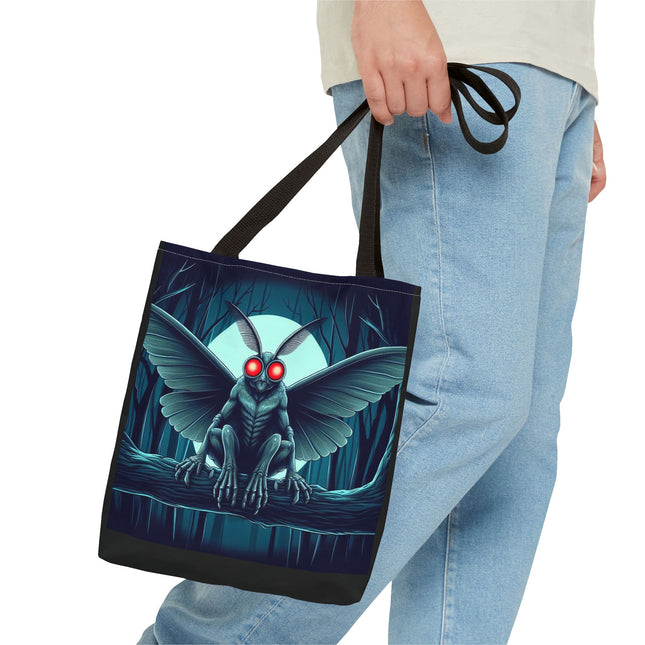 Stylish canvas tote bag featuring a unique Mothman design, perfect for carrying everyday essentials and for fans of cryptid lore.